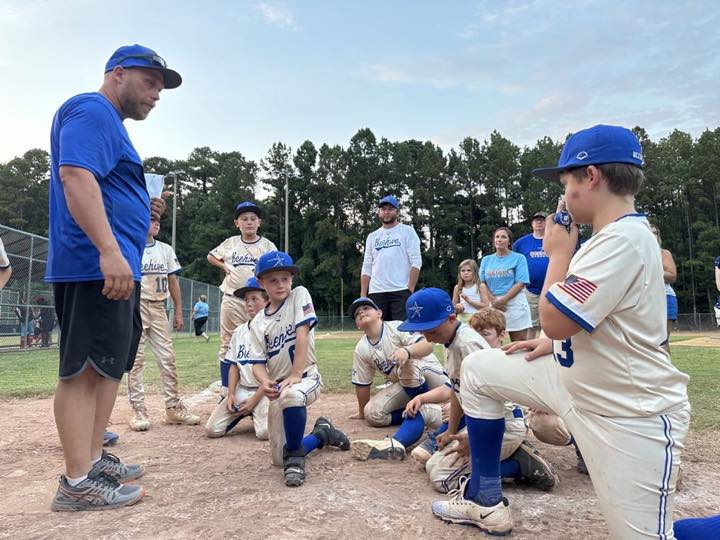 Coach speaking with 11U National players