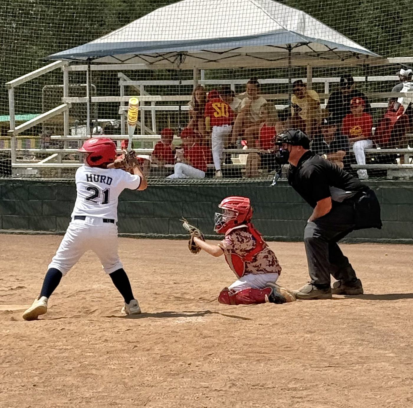 11U National catcher framing a pitch during tournament play