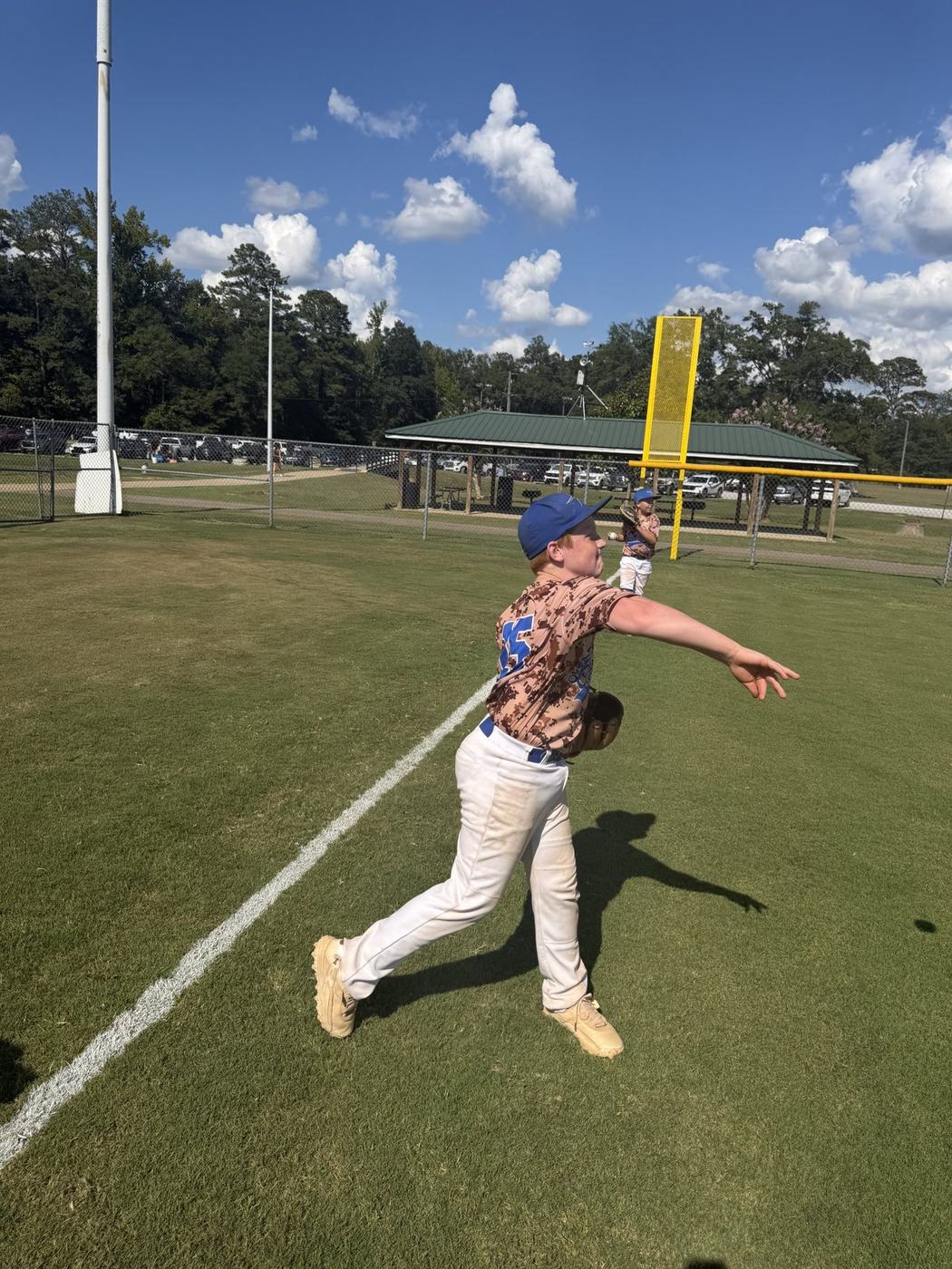 Throwing follow-through during 11U National warm-ups