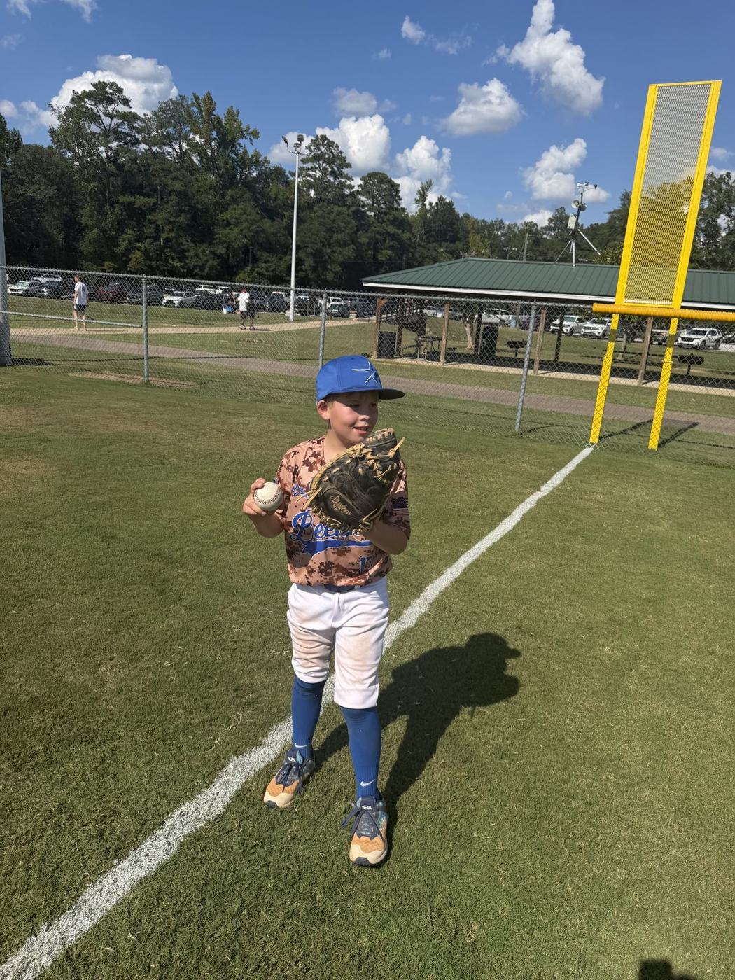 11U National player waiting on a throw during warm-ups