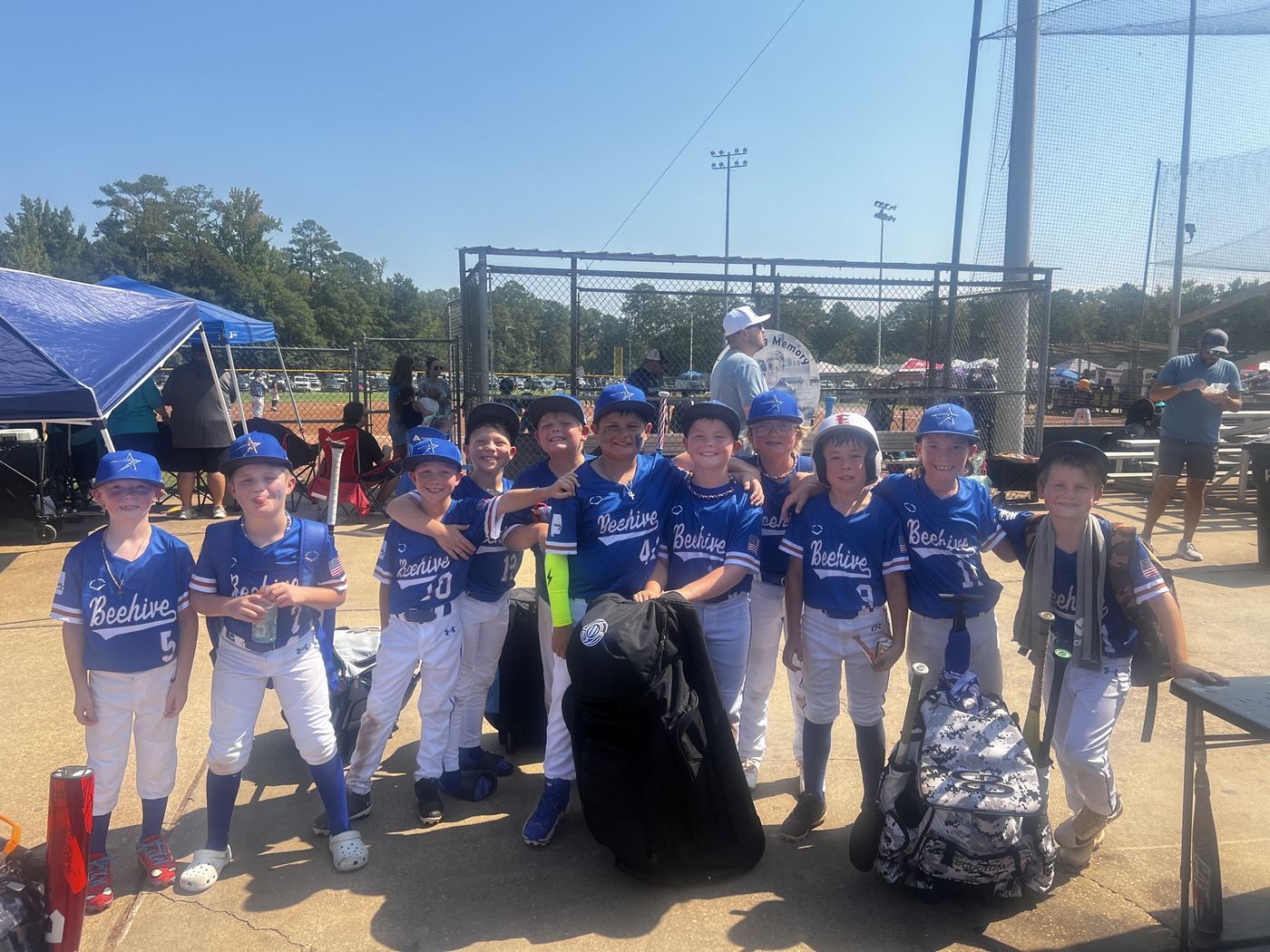 The 9U Beehive Stars crowded into the dugout for a team photo